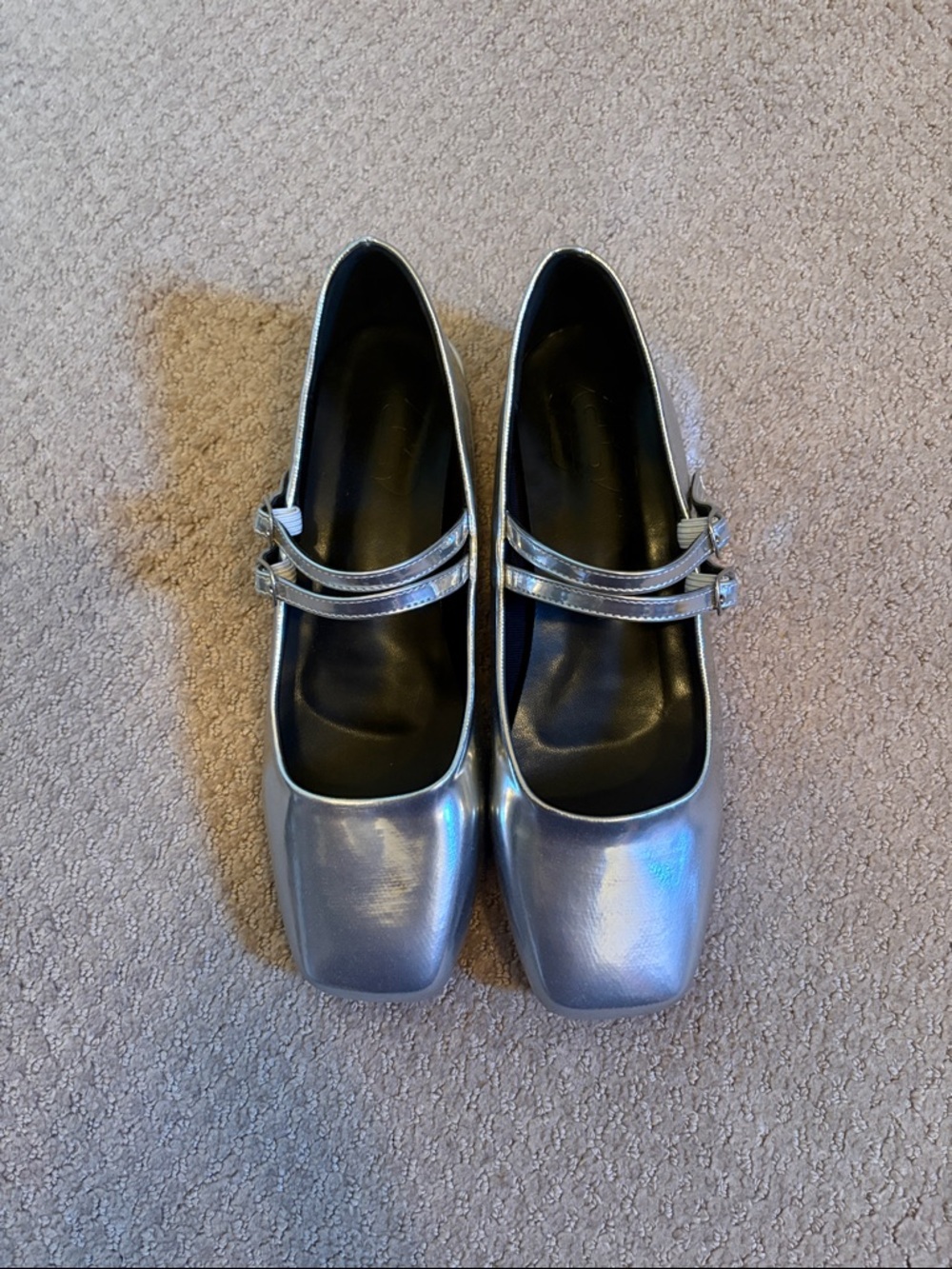 Never worn. New. Women's Metallic Silver Mary Jane Flats